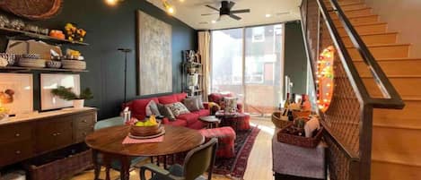 Second-floor Kitchen/ Dinette/ Living area with decorator lighting.