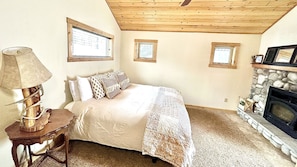 Master bedroom with king size bed, fireplace, and your own private entrance.