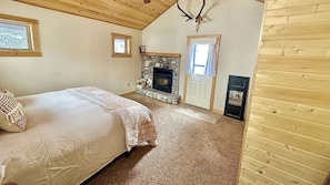 Master bedroom with king size bed, fireplace, and your own private entrance.