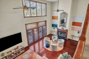 Wood-burning fireplace in the great room that fills with the most stunning natural light during all hours