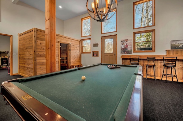 1,110 ft game room with pool table, sauna, arcade and poker table