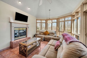 Family room with gas fireplace and lots of cozy blankets