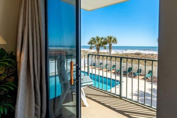 Extra wide balcony  that overlooks ocean and pool