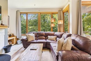 The vast windows allow plenty of light in the living room.