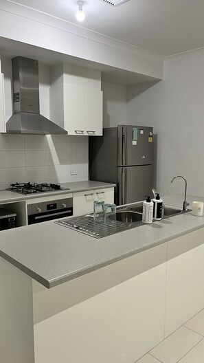 Modern kitchen with main essentials appliances 