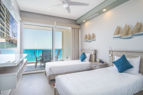 the guest bedroom offers two double beds, and separate patio access as well