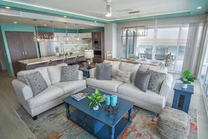 The seating area in the living room features comfortable sofas