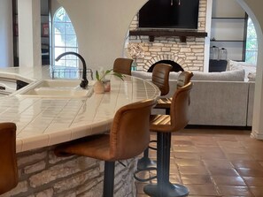 Large curved counter with bar stools