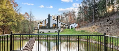 Escape to nature at Pine Hollow Lodge, nestled by a serene pond.