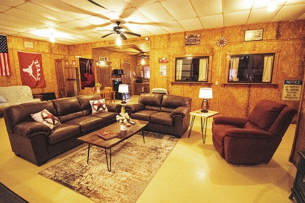 Comfy sofa and love seat along with a recliner. The lamps have USB plugs