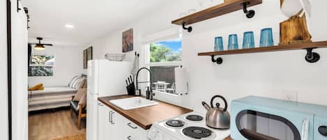 Enjoy the kitchen when you walk into your tiny home.
