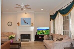 Living room with a large smart TV.