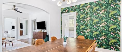 Dining room with seating for 6 at the dining table. The dining table also doubles as a ping pong table! Ping ping items located in the basket on the wall.