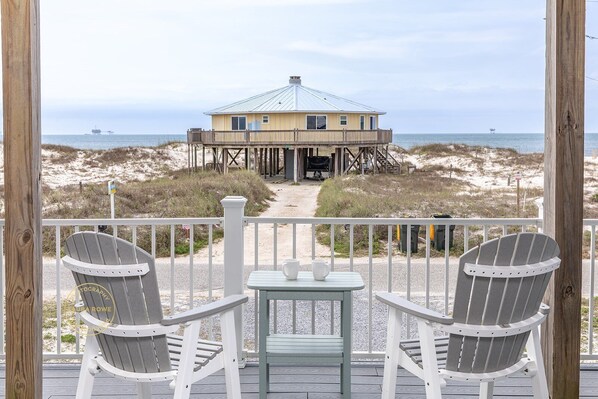 ake in sweeping views of natural sand dunes, wide open skies, and the sparkling Gulf of Mexico — all from the comfort of your front porch. It's the perfect place to sip coffee, watch the waves, and unwind.