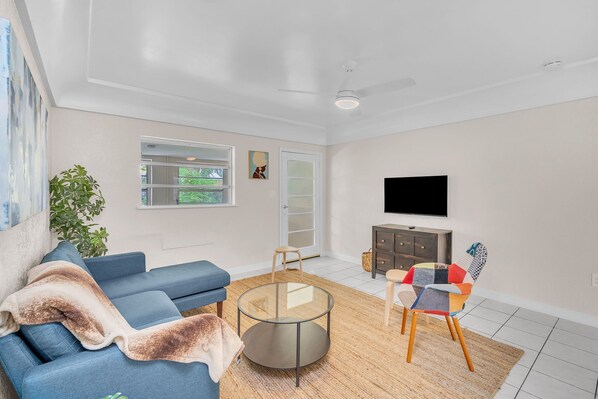 Unwind in the stylish and spacious living area, equipped with plush seats, great lighting, and wide screen TV. A perfect setup for catching up on your favorite TV shows or enjoying a movie marathon.