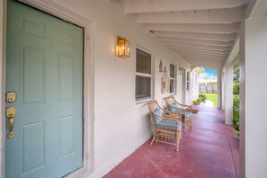 Entrance and porch with outdoor seating area