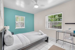 Experience the comfort and convenience of the guest bedroom, equipped with a comfortable full bed and a well-appointed work desk, ensuring a pleasant stay for our guests who require a productive workspace.
