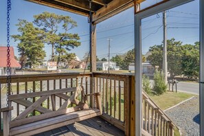 Sugar Shores has 2 Levels of Covered Porches facing the Chincoteague Channel.