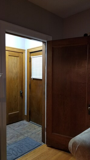 View of front door entry area with coat closet. 