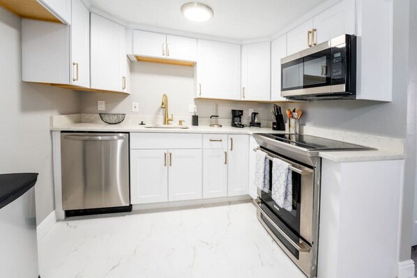 Full Kitchen with stove and pot/pans & cooking utensils