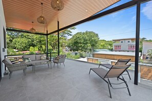 Private balcony with sitting area and sun beds