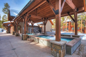 Unwind in one of our four hot tubs, perfect after a long day of adventure.