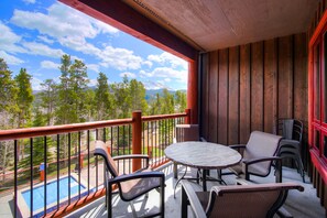 Relax and unwind on our private balcony with pool and mountain views.