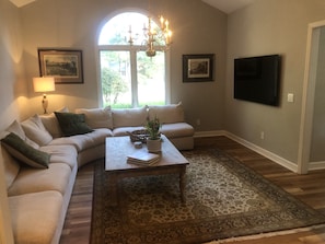 Cozy TV room with new smart TV.