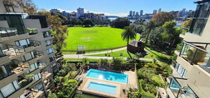 The views from balcony overlook Rushcutters Bay Oval and the complexes 2 pools