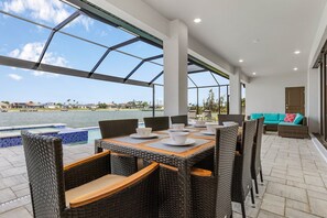 Outdoor dining area for al fresco meals by the pool
