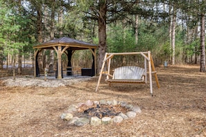 Enjoy a relaxing bonfire or sit under the covered cabana!
