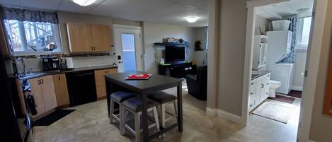 Bright Eat-In Kitchen, Living Room & 3pc Bathroom with laundry.