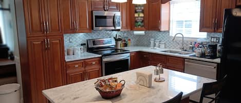 The newly renovated kitchen is the center and heart of the open floor plan.