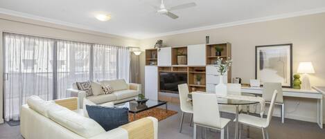 Relax and unwind in this living room. The comfortable seating, dining area, and home office nook provide the perfect setting for both relaxation and productivity.