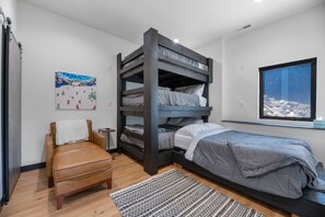 CONTROL CENTER with its quadruple stack bunk beds and Gaming console. Perfect for the kids!