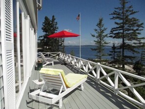 Large wooden decks surround the house