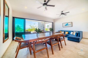 A dining area is in front of the sliding doors and it’s great to leave the doors open for a wonderful breezy indoor/outdoor connection