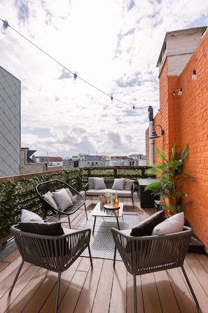 Cozy rooftop terrace with lounge