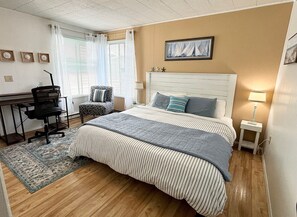 King size bed in the back bedroom with it's own ensuite and private work area. 
