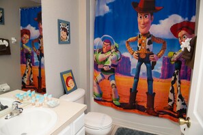 Twin over full Toy Story bunk room with attached bath