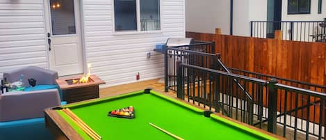 Beautiful slate pool table, gas grill, and fire place in a fully fenced yard 