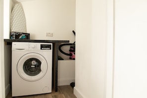 Utility Room With Washing Machine and Ironing Facilities
