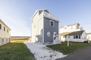 Shell-lined driveway accommodates three full-sized vehicles