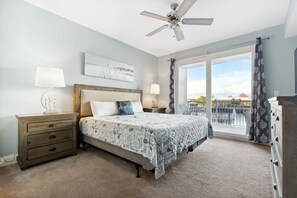 Spacious Primary Bedroom with King Size Bed, Flat Screen TV, Lake Views, Balcony Access and Ensuite Bathroom