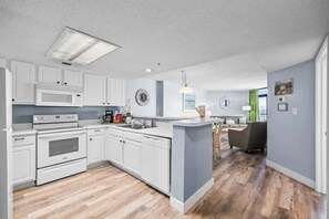 Fully stocked kitchen with everything you need for home-cooked meals by the beach.

