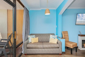Experience the perfect blend of style and comfort in this inviting sofa bed