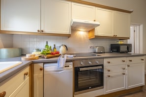 Kitchen with an electric oven and hob