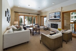 Main Living Space - TV, Deck and Wood burning fireplace (wood provided)