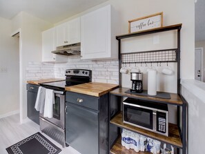 Butcher block counter tops by stove / oven coffee bar 