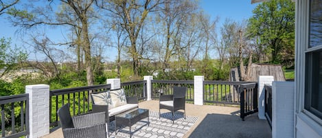 Enjoy the fresh air and sunshine on the Back Deck, with outdoor seating available for 4